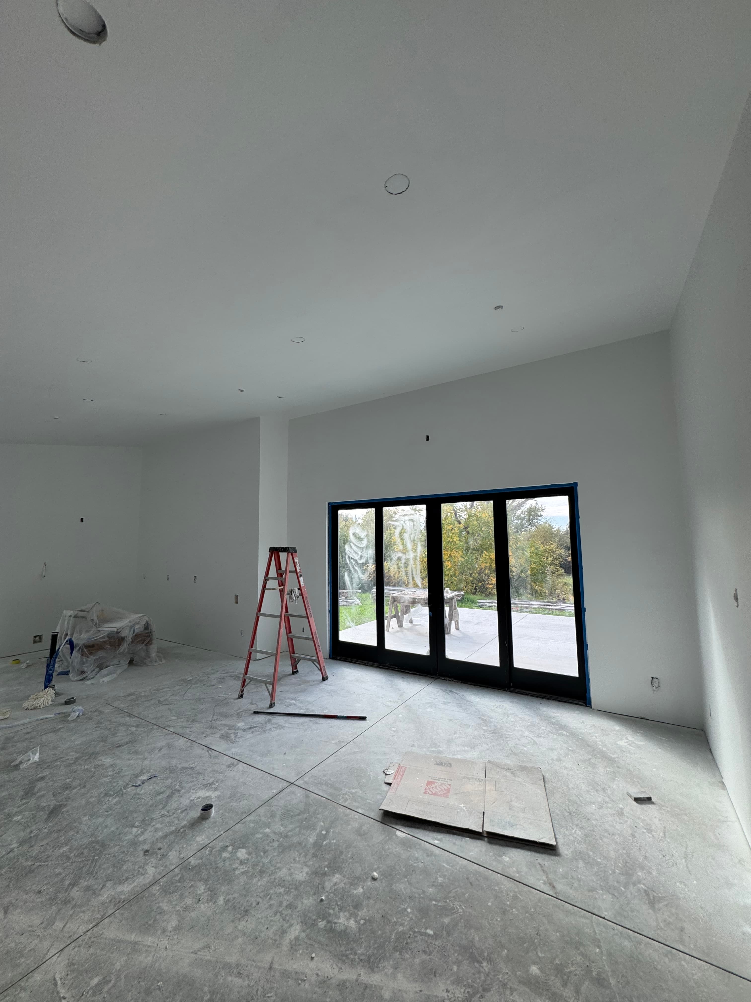 Clean high-ceiling ADU drywall installation