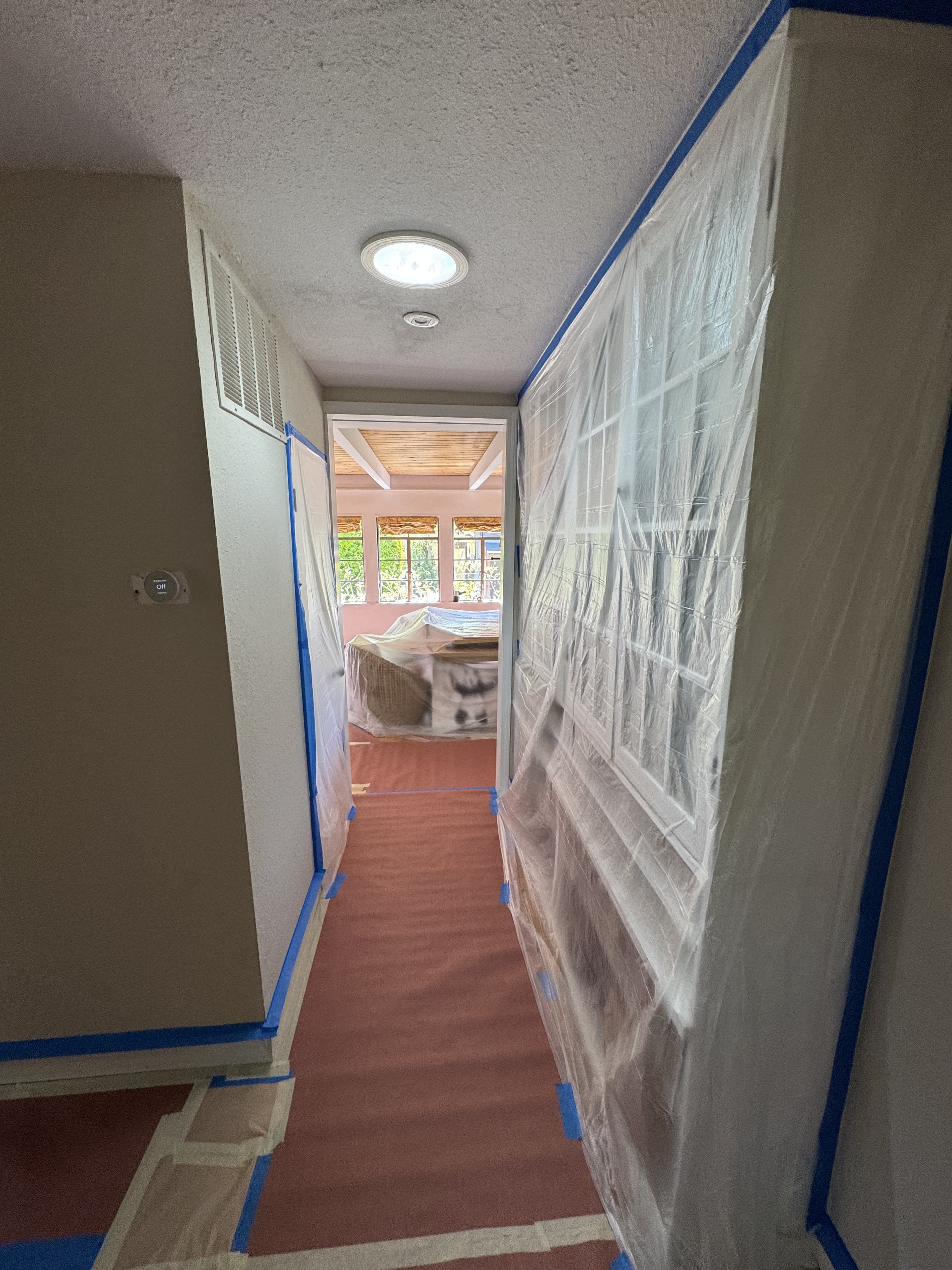 Spacious living room with vaulted ceiling and finished drywall