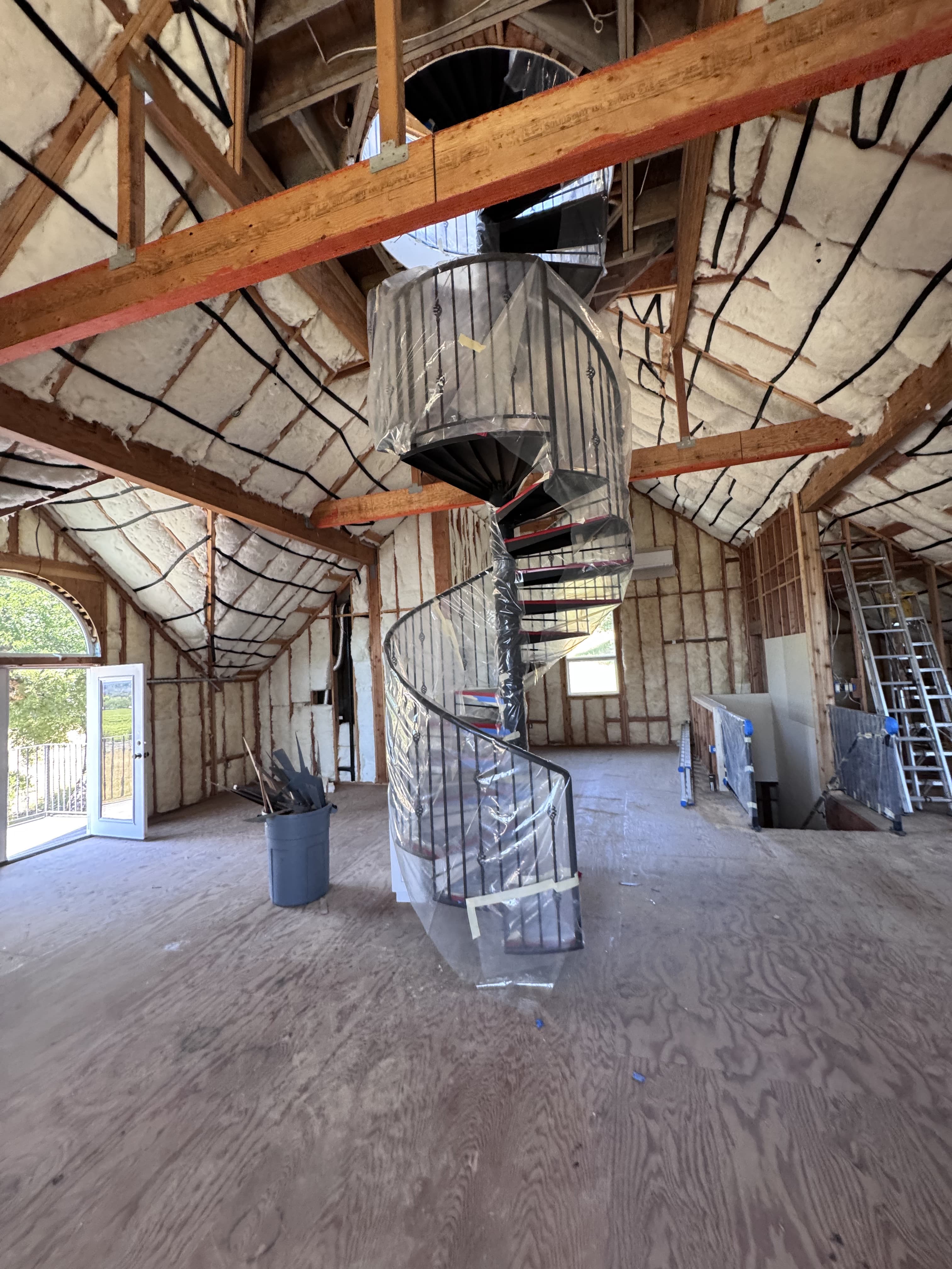 Project manager reviewing drywall scheduling plans